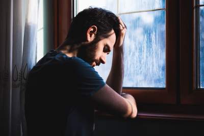 Man having racing thoughts and worried with mind racing